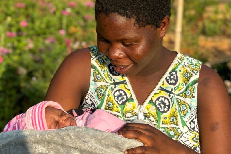 Ellen Kaphamtengo holding her son Justice