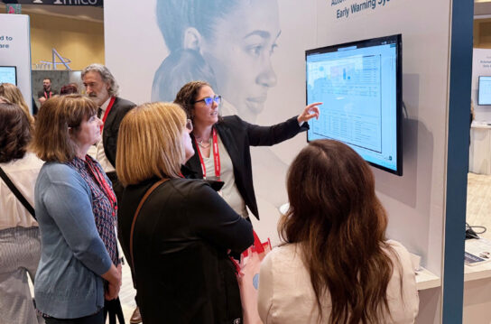 Lacey gives a demo at a tradeshow